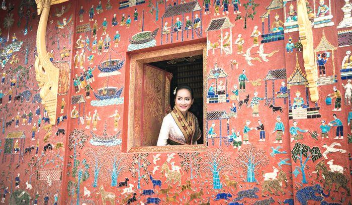 Laos Luang Prabang Wat Xiang Thong Lady Pink